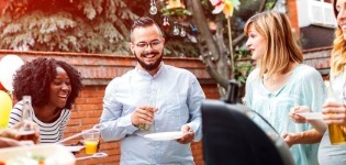 Friends enjoying barbecue outdoors.